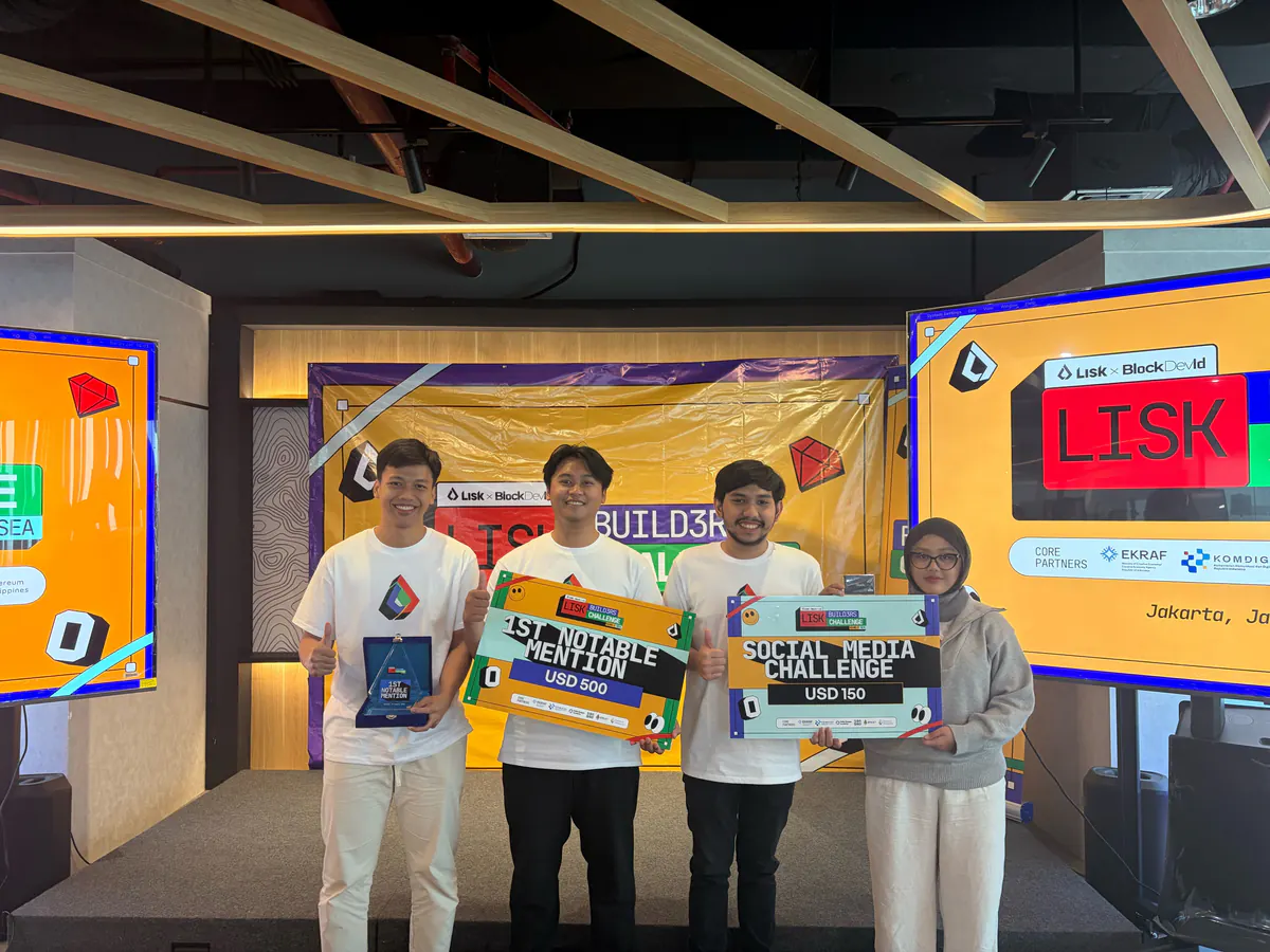 Nova teammates hold Lisk Builders Challenge award boards on a stage.
